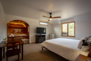 WhaleBeing Mental Health & Wellness Yoga Retreat - the bedroom and tub inside The Rancher room
